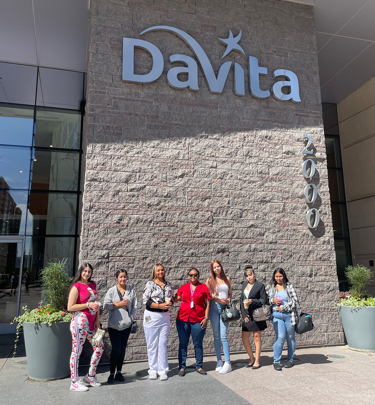 Group outside DaVita building entrance.