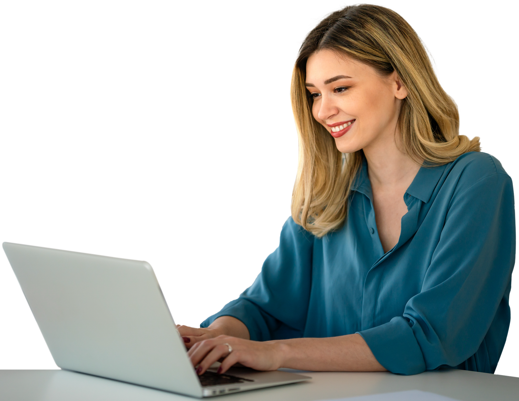 Woman in blue shirt using laptop at desk.