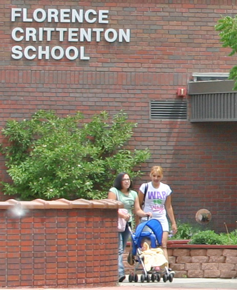 Two women with stroller outside Florence Crittenton School.