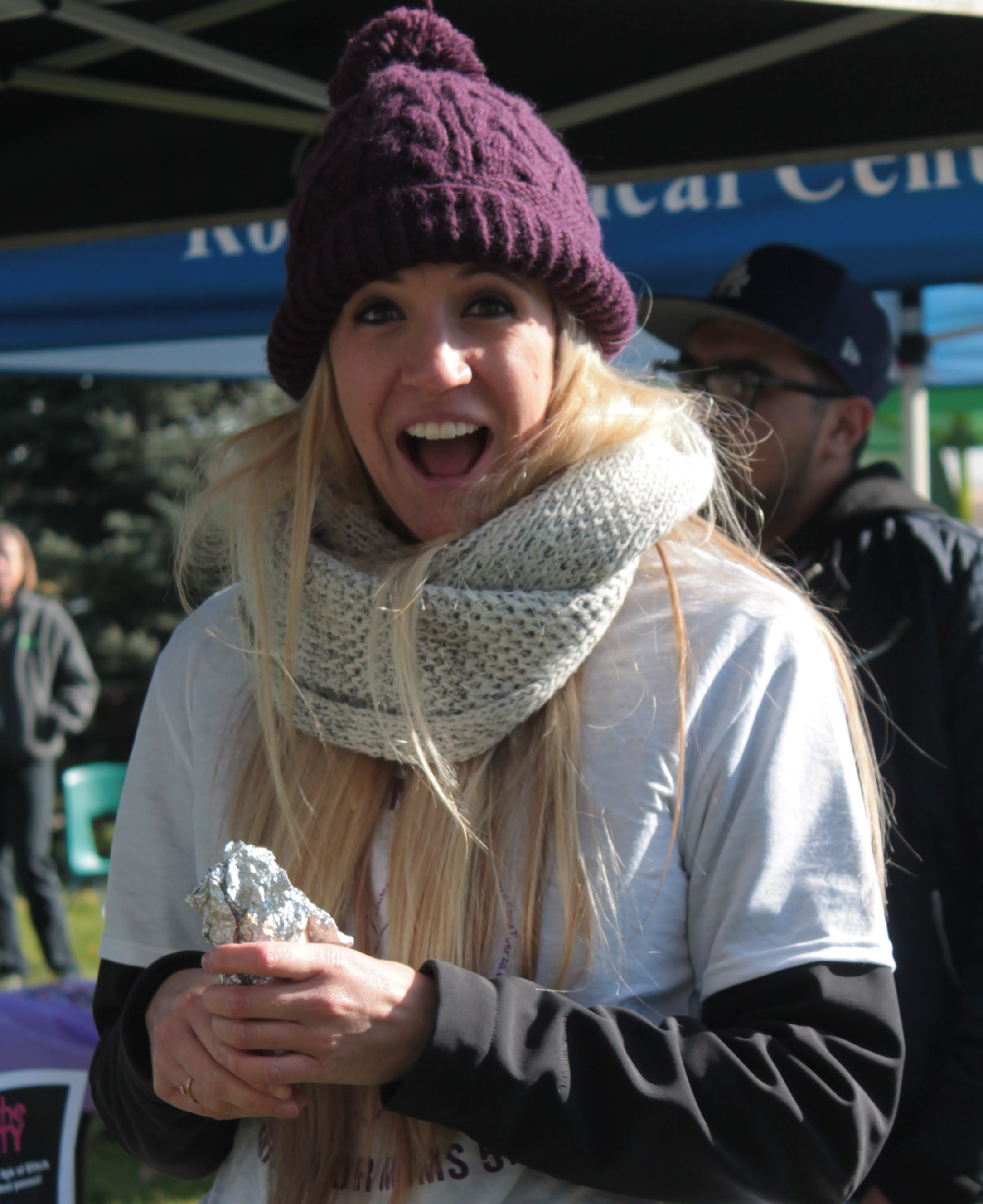 Person smiling in winter clothing outdoors