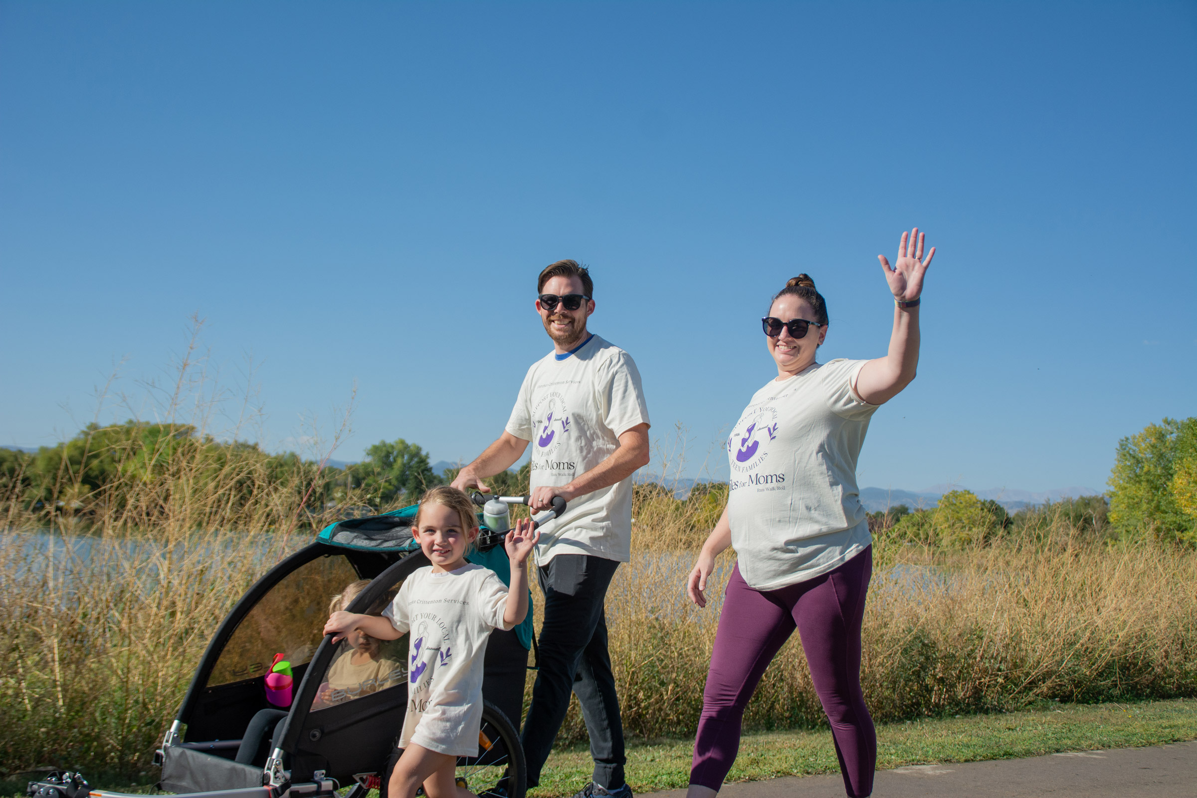 Family enjoying outdoor walk on sunny day