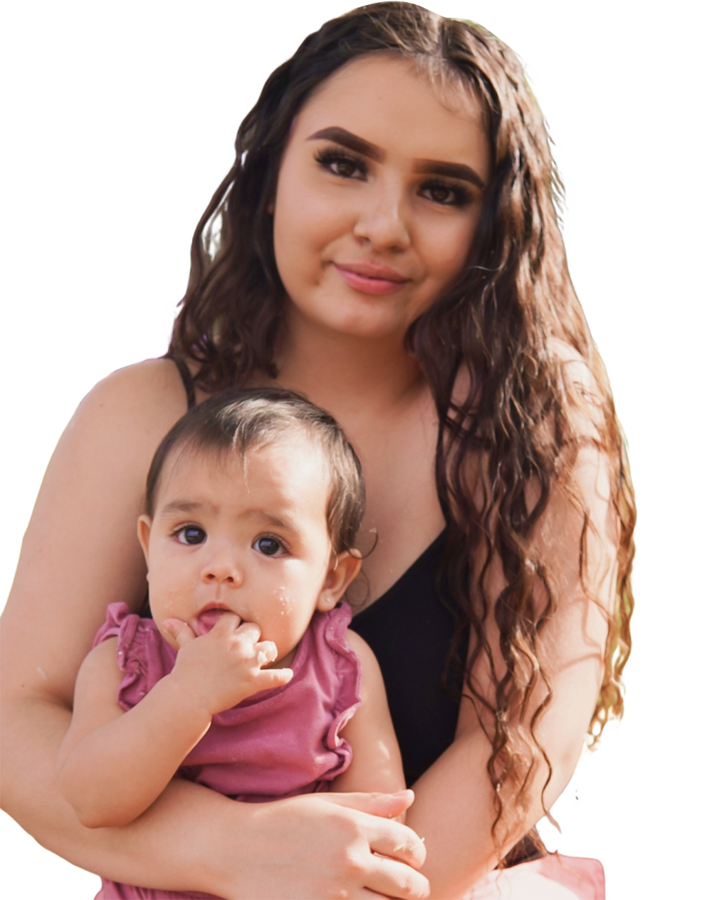Woman holding baby and smiling.