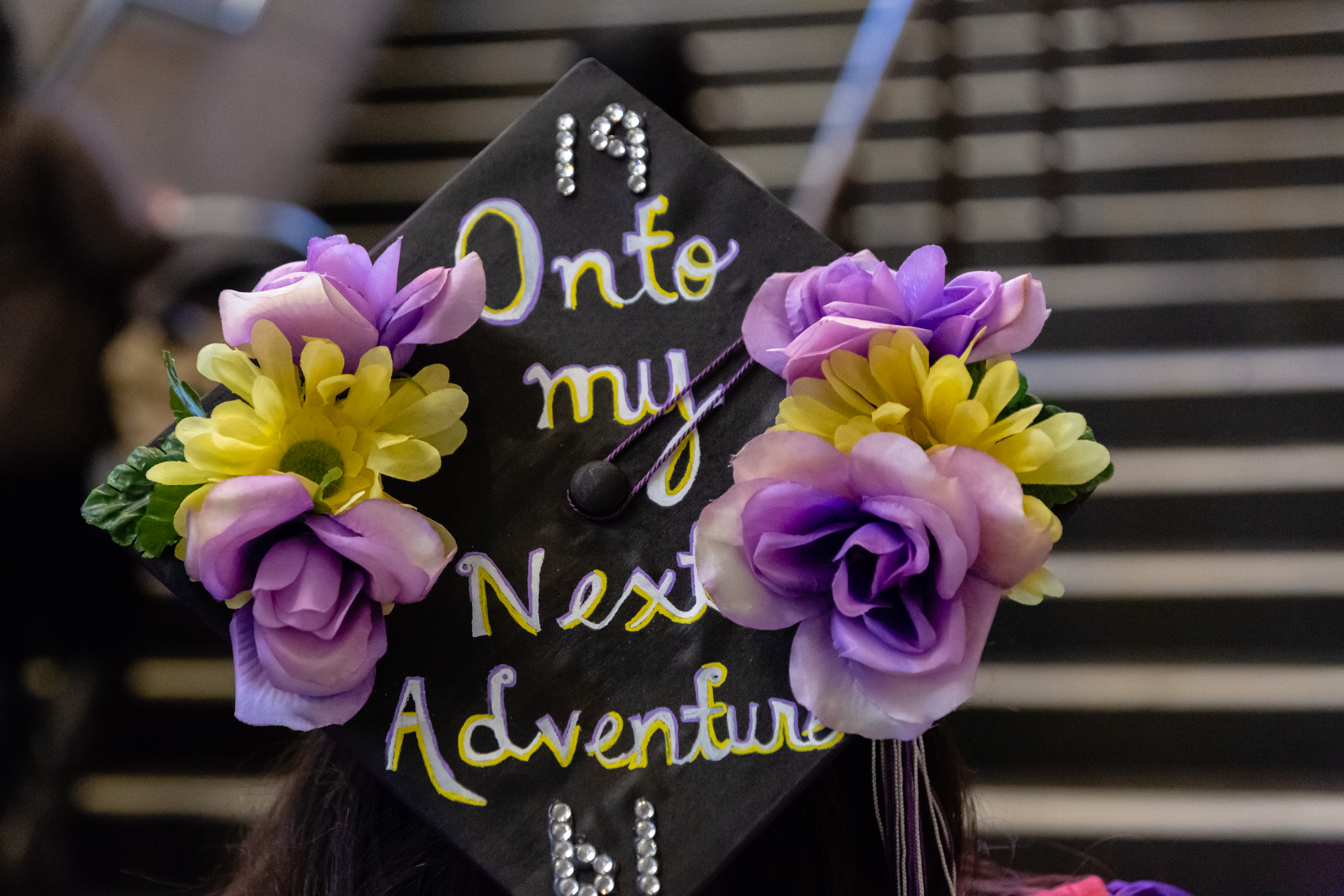 Graduation cap with flowers and inspirational message.