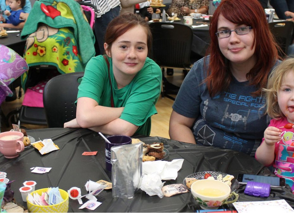 Family enjoying snacks at a community event.